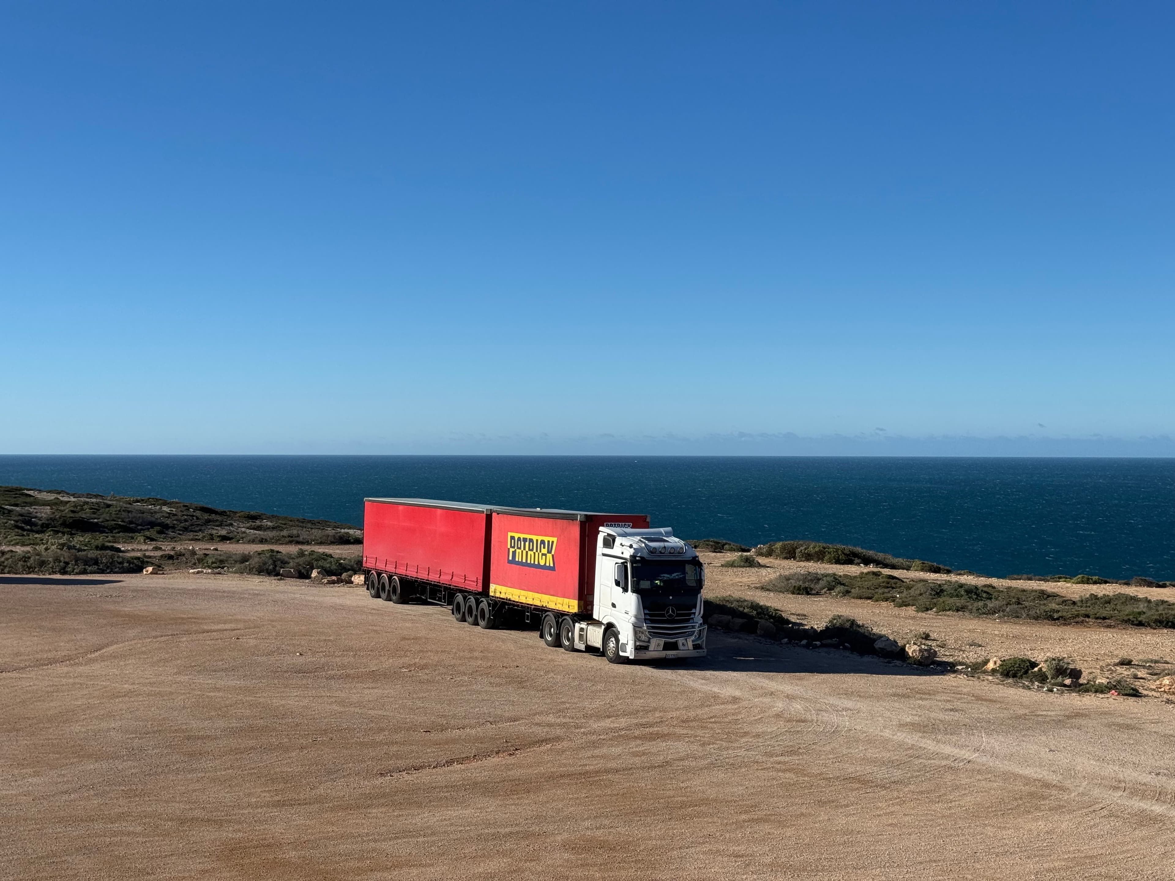 Commercial vehicle in transit, representing the volume of submissions moving through the brokerage's pipeline